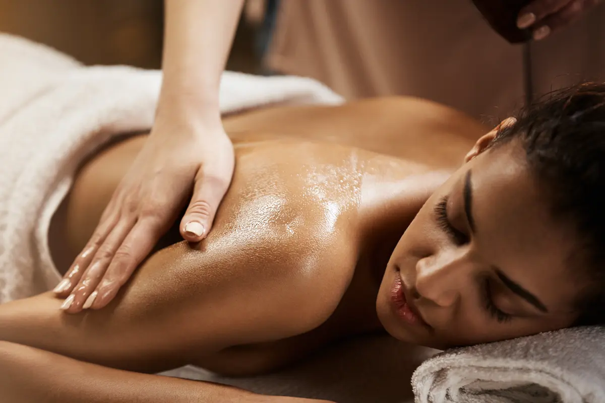 Calm woman receiving professional massage treatment